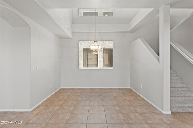 1453 E S Fork Dr, Phoenix, AZ 85048 - unfurnished dining area with a chandelier, stairs, baseboards, arched walkways, and tile patterned flooring