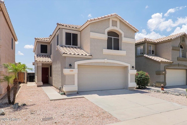 1453 E S Fork Dr, Phoenix, AZ 85048 - mediterranean / spanish house with a tile roof, stucco siding, a garage, and concrete driveway