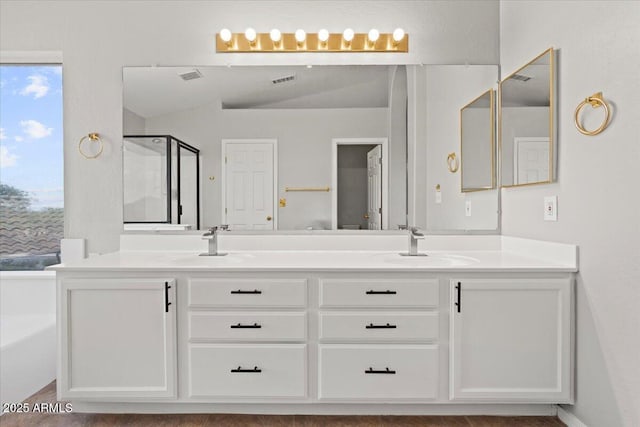 1453 E S Fork Dr, Phoenix, AZ 85048 - bathroom featuring double vanity, a stall shower, healthy amount of natural light, lofted ceiling, and a garden tub