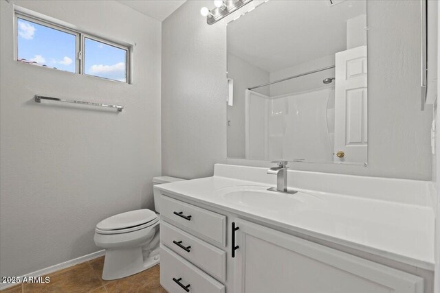1453 E S Fork Dr, Phoenix, AZ 85048 - bathroom with vanity, toilet, baseboards, a shower, and tile patterned floors