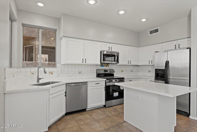 1453 E S Fork Dr, Phoenix, AZ 85048 - kitchen with appliances with stainless steel finishes, a sink, light countertops, white cabinetry, and recessed lighting