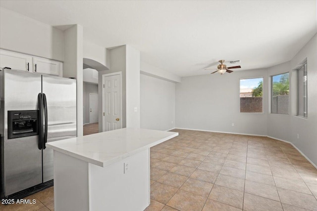 1453 E S Fork Dr, Phoenix, AZ 85048 - kitchen featuring stainless steel fridge with ice dispenser, a ceiling fan, arched walkways, a center island, and white cabinetry