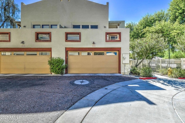 exterior space featuring fence and driveway