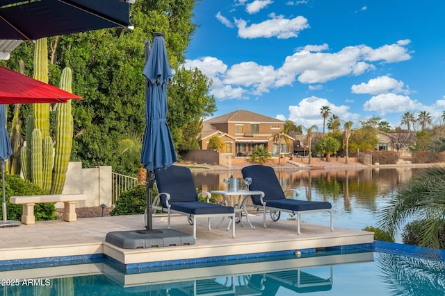 exterior space with a patio and a water view