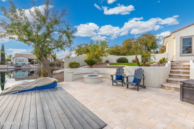 view of patio featuring a fire pit