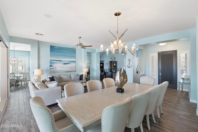 dining room featuring dark hardwood / wood-style flooring and a chandelier