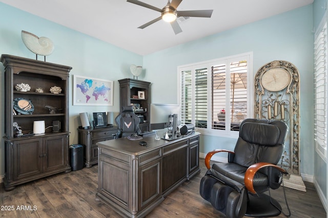 home office featuring ceiling fan and dark hardwood / wood-style flooring