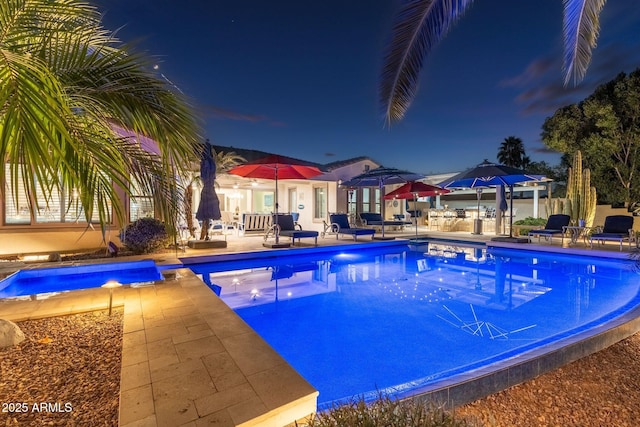 view of pool featuring an outdoor hot tub and a patio