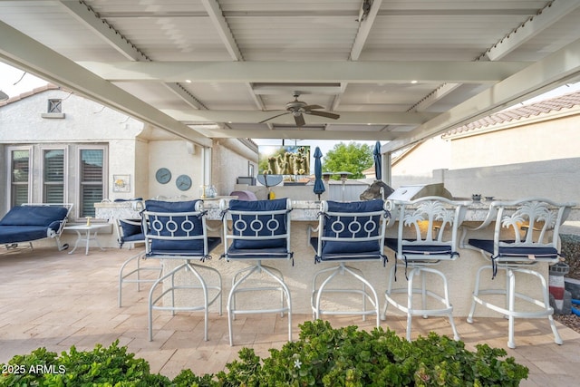 view of patio featuring ceiling fan