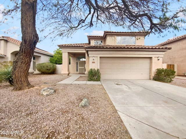 mediterranean / spanish-style house featuring concrete driveway, an attached garage, a tile roof, and stucco siding