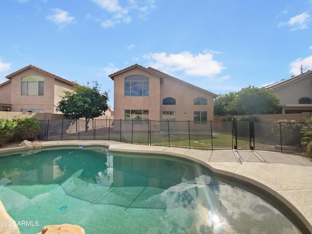 view of pool with a fenced in pool and fence