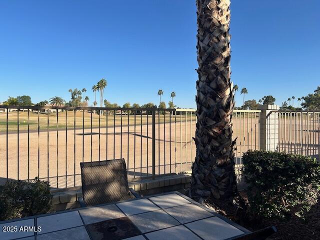 view of gate with fence