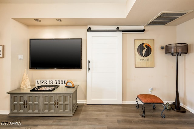 5209 N 78th St, Scottsdale, AZ 85250 - living area with wood finished floors, baseboards, and a barn door