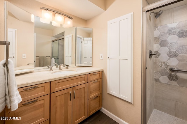5209 N 78th St, Scottsdale, AZ 85250 - bathroom featuring a stall shower, vanity, and wood finished floors