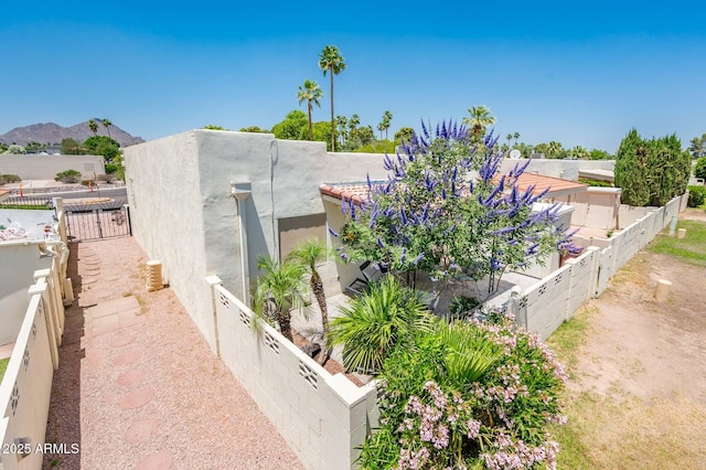 5209 N 78th St, Scottsdale, AZ 85250 - view of property exterior featuring stucco siding and a fenced backyard