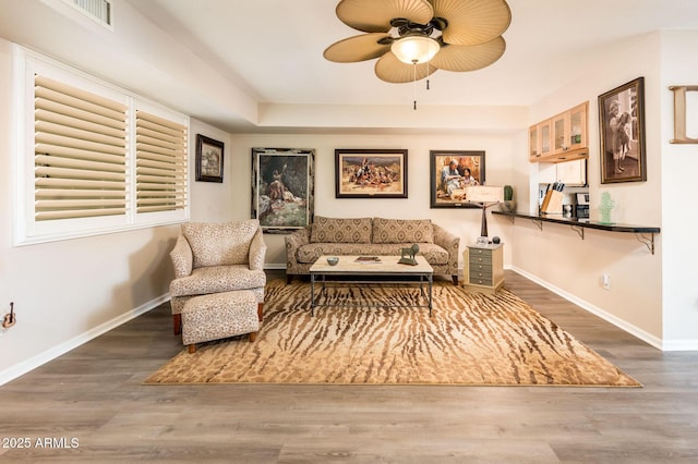 5209 N 78th St, Scottsdale, AZ 85250 - living area with a ceiling fan, baseboards, and wood finished floors