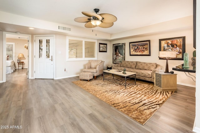 5209 N 78th St, Scottsdale, AZ 85250 - living room featuring a ceiling fan, wood finished floors, and baseboards