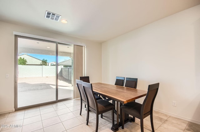 dining area with light tile patterned flooring