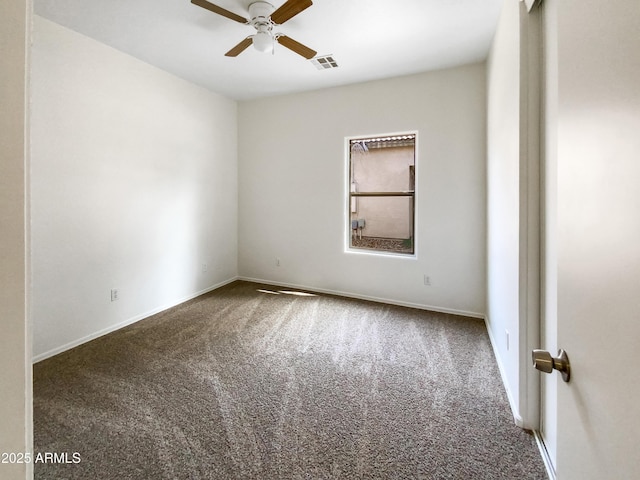 carpeted empty room featuring ceiling fan