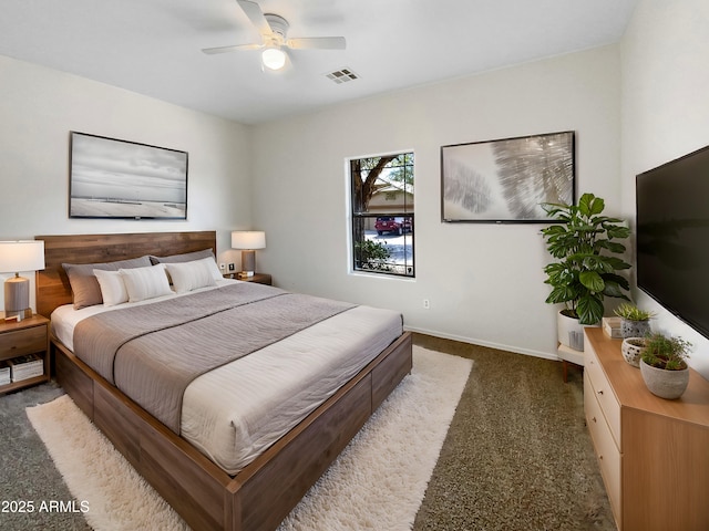 bedroom with ceiling fan and dark colored carpet