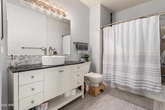 bathroom featuring vanity, toilet, and hardwood / wood-style floors