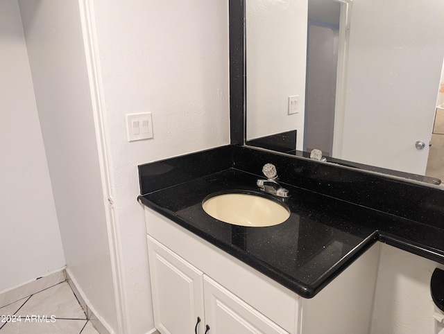 bathroom featuring tile floors and vanity