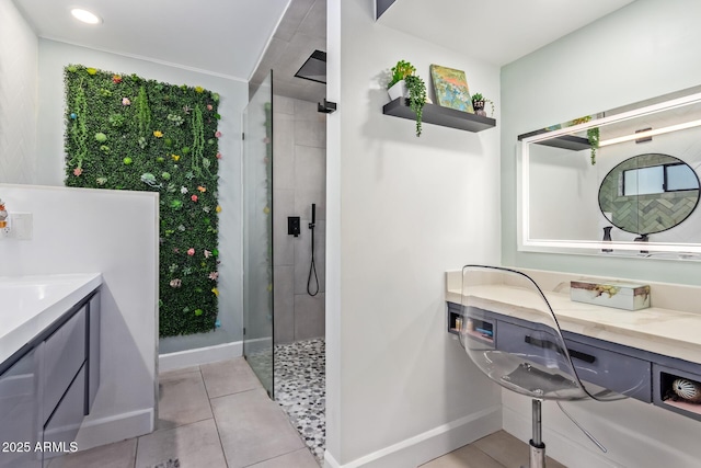 bathroom featuring vanity, tile patterned flooring, and a shower