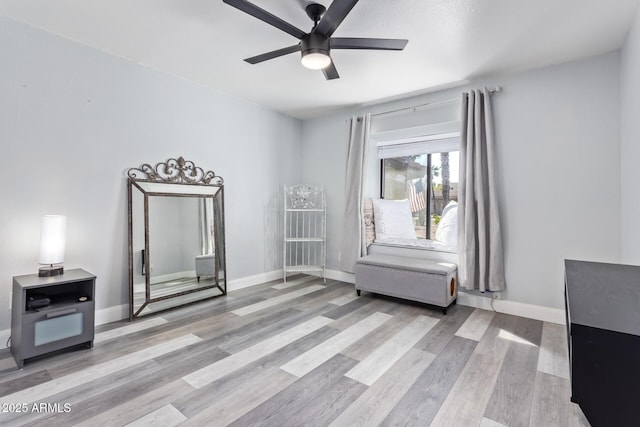 sitting room with ceiling fan and light hardwood / wood-style floors