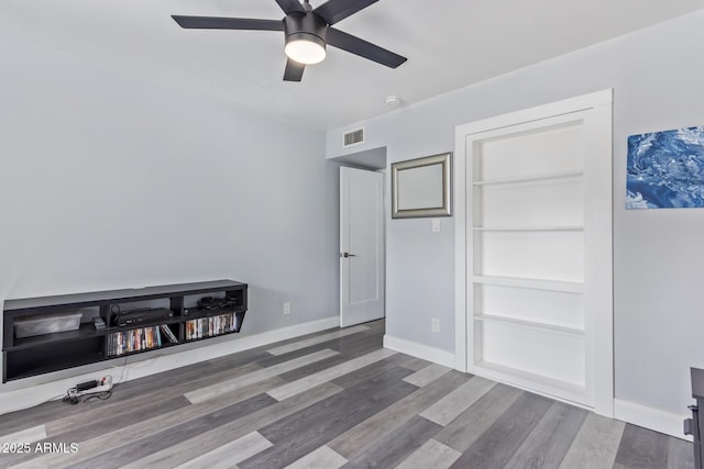 bedroom featuring hardwood / wood-style flooring and ceiling fan