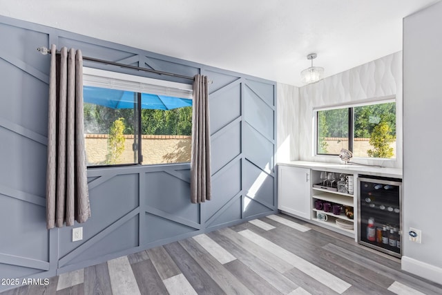 entryway featuring beverage cooler and light wood-type flooring