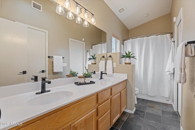 full bathroom featuring shower / tub combo with curtain, vanity, lofted ceiling, and toilet