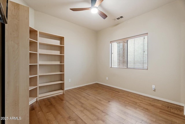 unfurnished room featuring wood-type flooring and ceiling fan