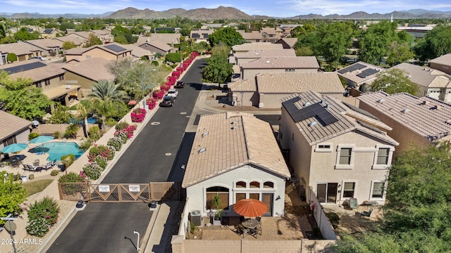 birds eye view of property with a mountain view