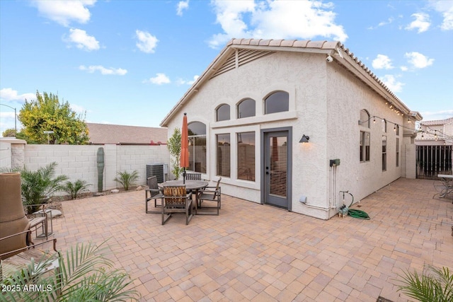 back of house featuring central AC and a patio