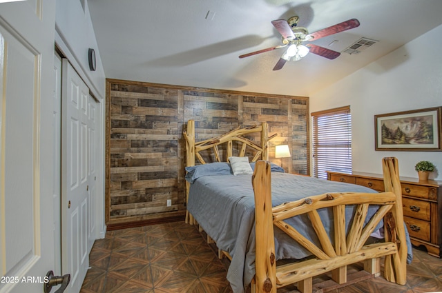 bedroom with vaulted ceiling, a closet, and ceiling fan