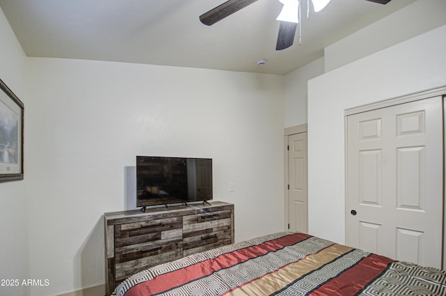 bedroom featuring ceiling fan and a closet