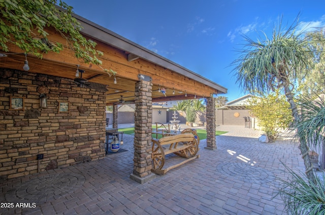 view of patio with ceiling fan