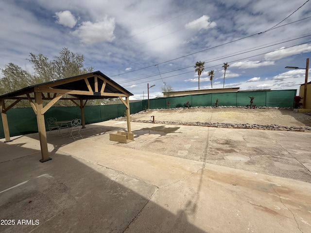 view of patio / terrace featuring a gazebo and fence