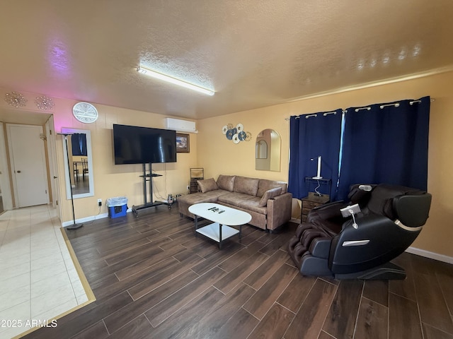 living area with arched walkways, baseboards, a textured ceiling, and wood tiled floor