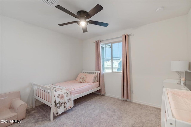 carpeted bedroom with ceiling fan