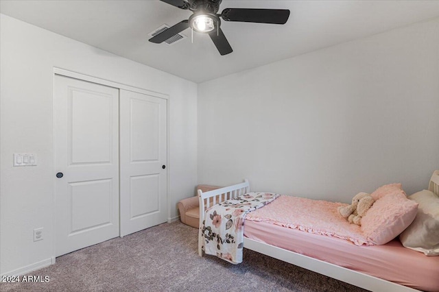 bedroom featuring a closet, ceiling fan, and carpet