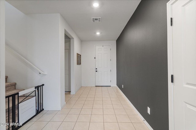 hallway with light tile patterned flooring