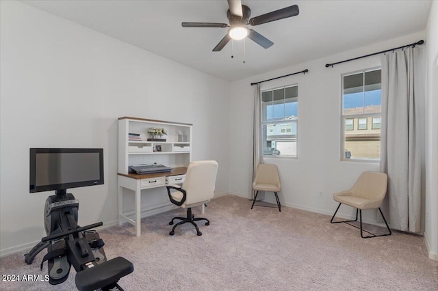 carpeted home office with ceiling fan