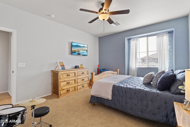 carpeted bedroom with ceiling fan