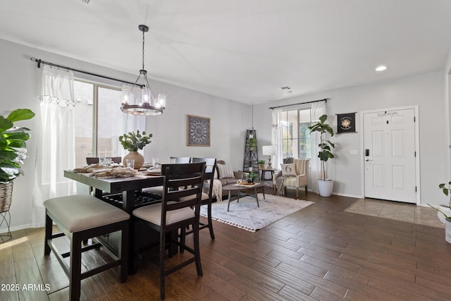 dining space with dark wood-type flooring