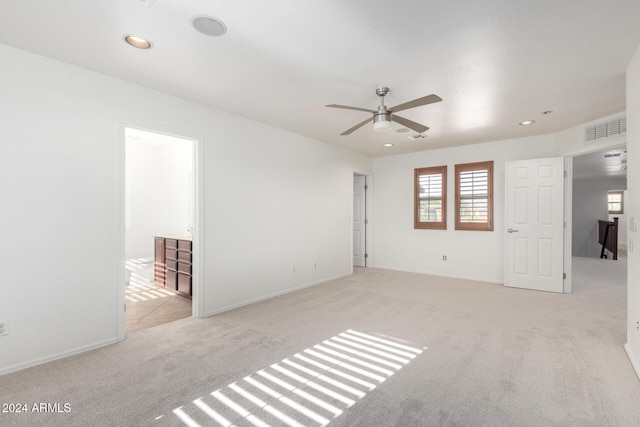 carpeted empty room with ceiling fan