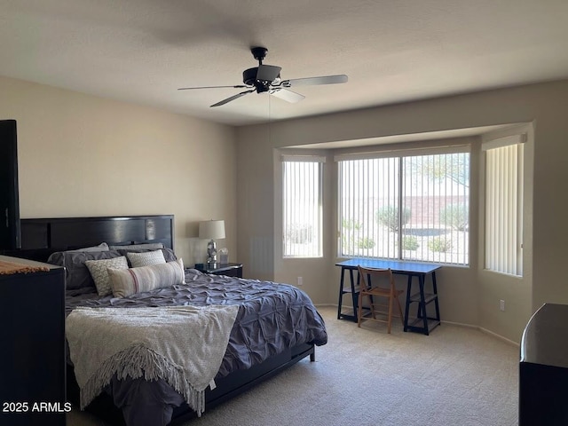 bedroom with carpet floors, baseboards, and ceiling fan
