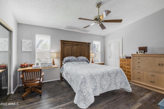 bedroom featuring a textured ceiling, dark hardwood / wood-style floors, ceiling fan, and lofted ceiling