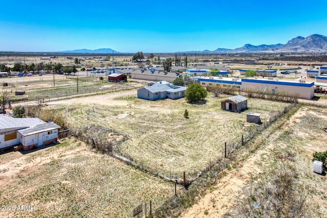 drone / aerial view with a mountain view and a rural view