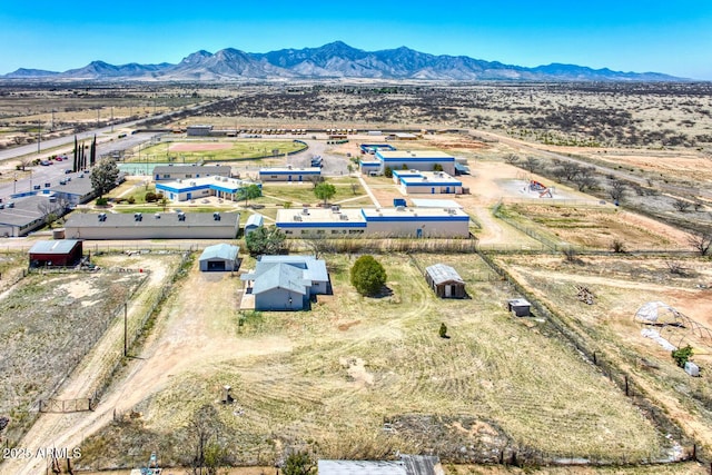 birds eye view of property featuring a mountain view